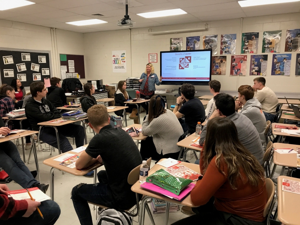 person talking to a room of students